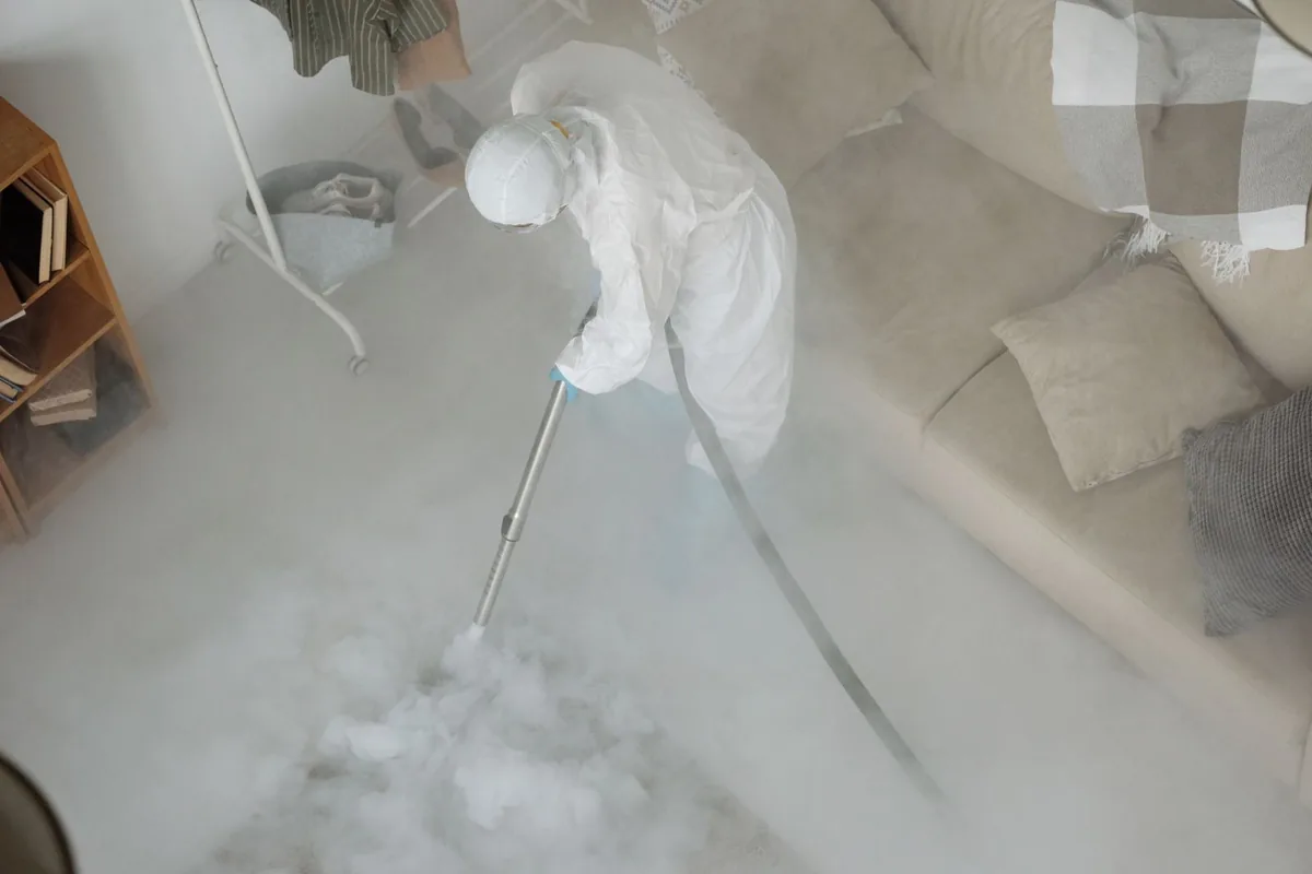 Biohazard cleanup technician in protective equipment, Palm Beach Gardens, FL